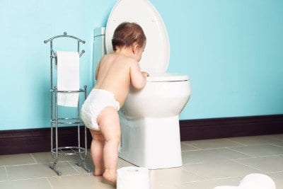 Baby looking into toilet