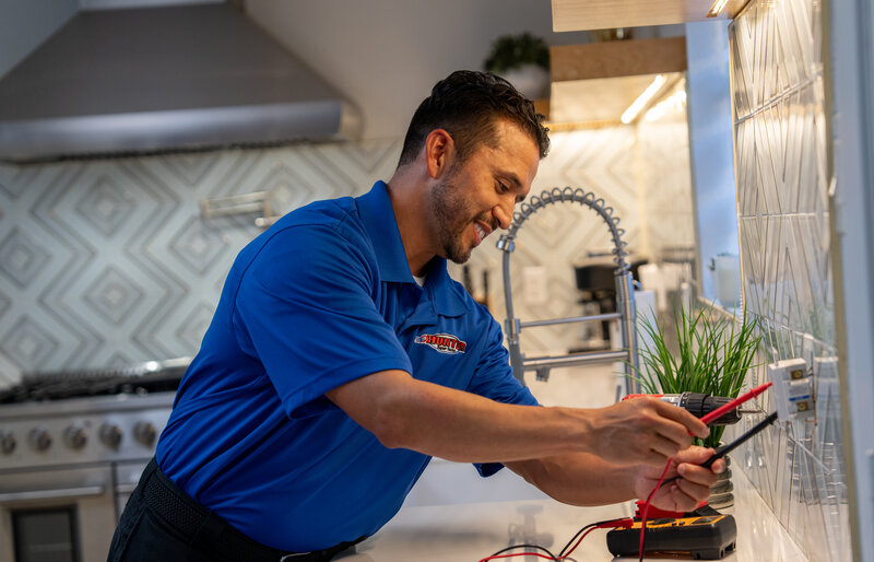 Electrician performing wiring installation service
